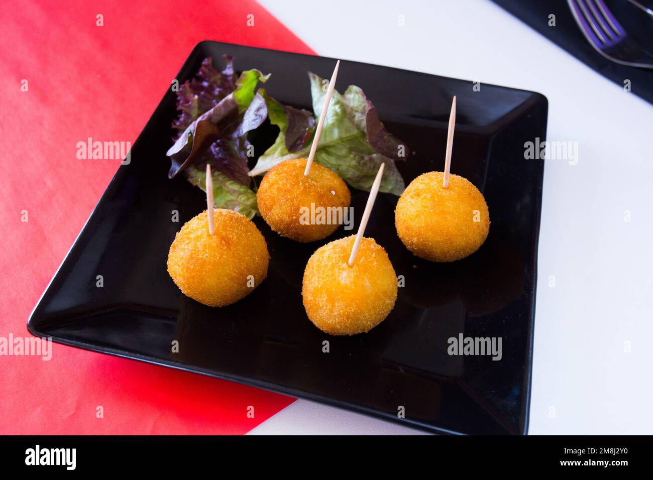 Spanish croquettes. The croquette is a portion of dough made from a