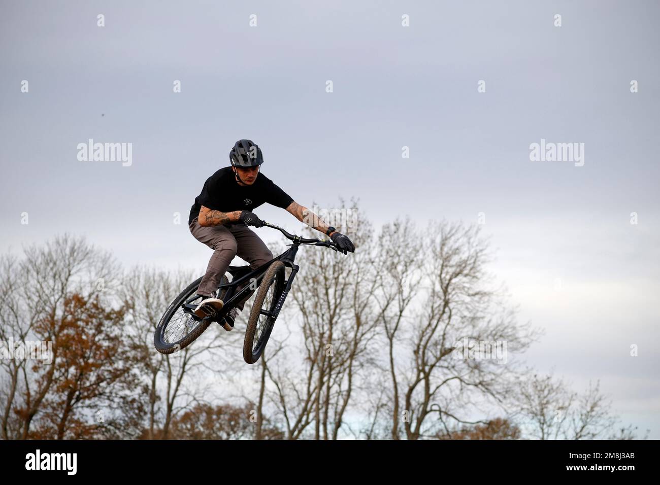Mountain bike riders in action at a BMX and pump track near Fleet in Hampshire Stock Photo Alamy