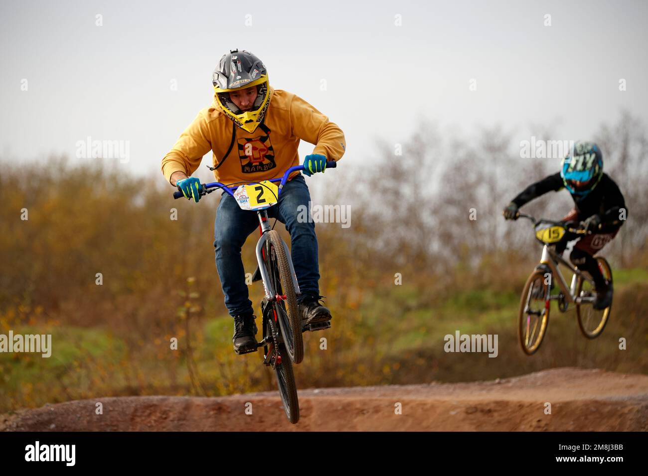 Mountain bike riders in action at a BMX and pump track near Fleet in Hampshire Stock Photo Alamy