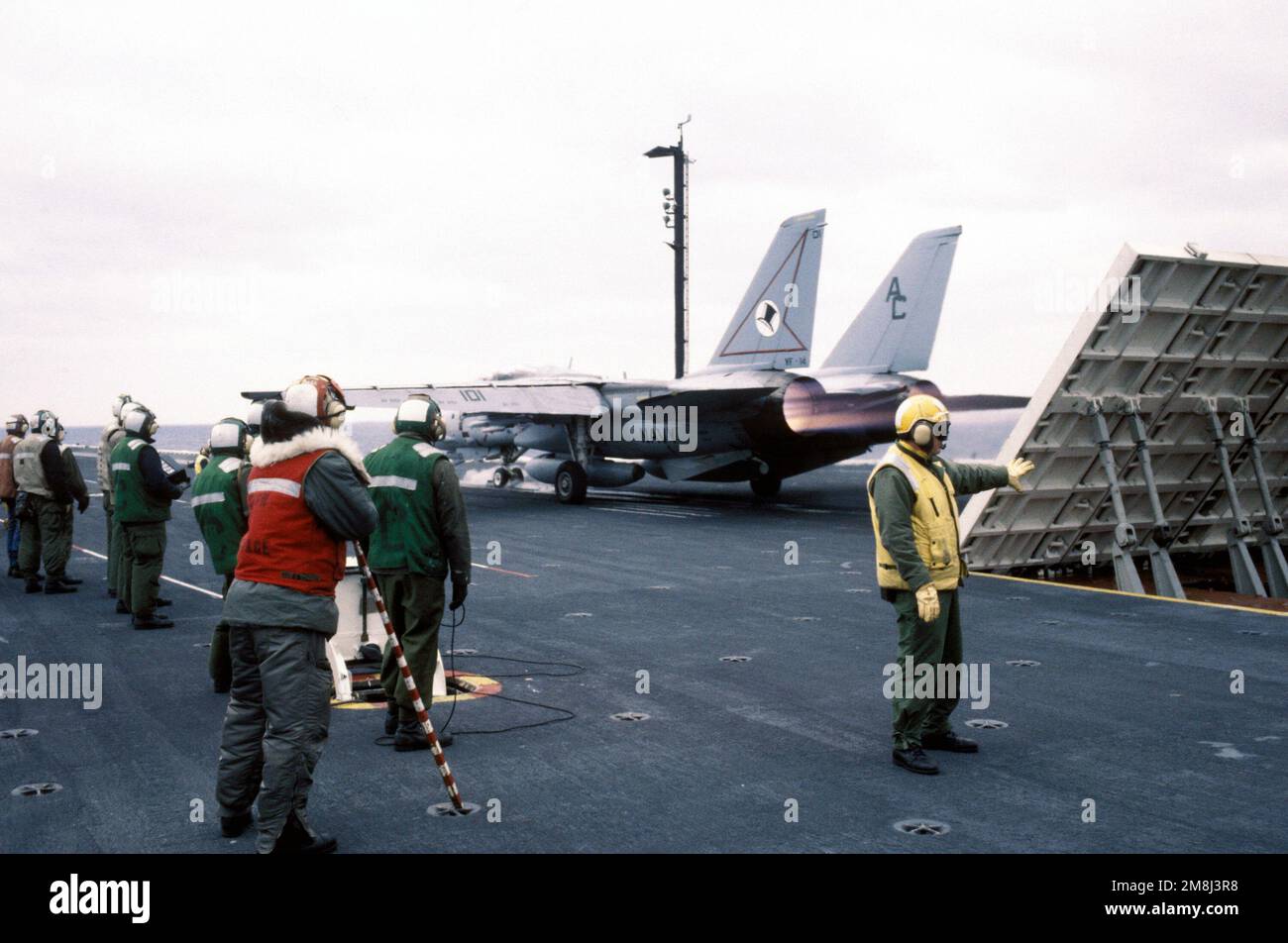 An F14A Tomcat aircraft of Fighter Squadron Fourteen (VF14) revs up