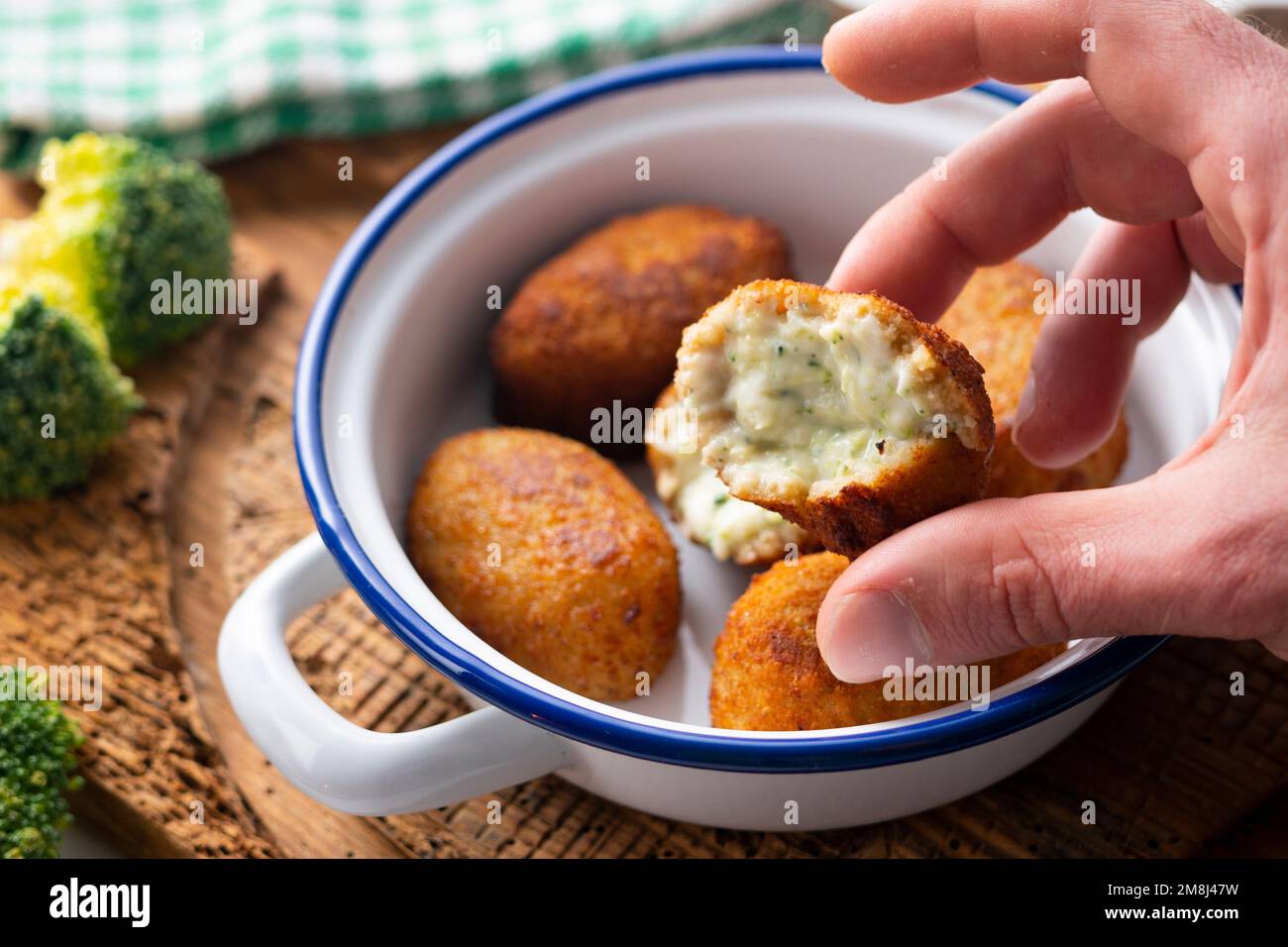 Broccoli croquette. The croquette is a portion of dough made from a