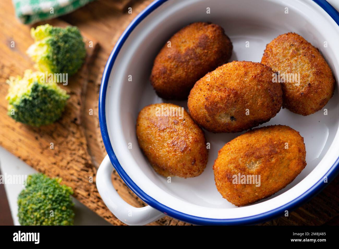Broccoli croquette. The croquette is a portion of dough made from a