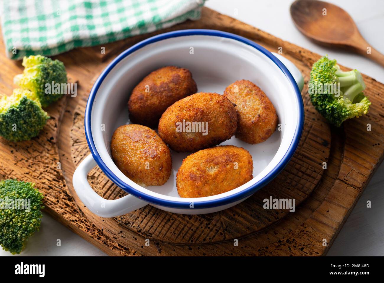 Broccoli croquette. The croquette is a portion of dough made from a