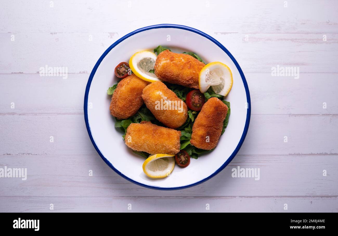 Fish croquette. The croquette is a portion of dough made from a dense