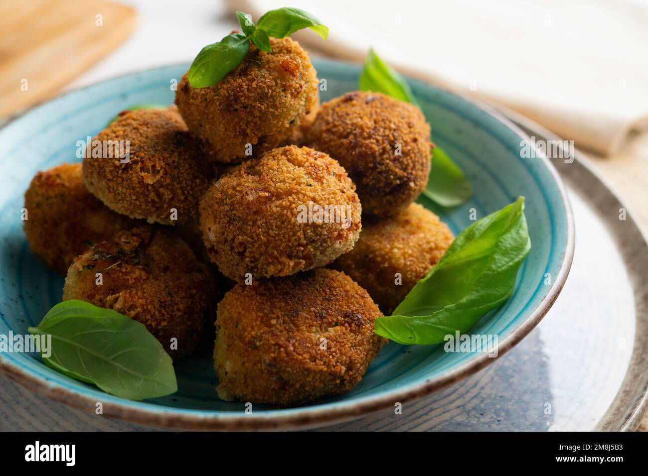 Spanish vegan croquettes. Portion of dough made from a dense sauce such