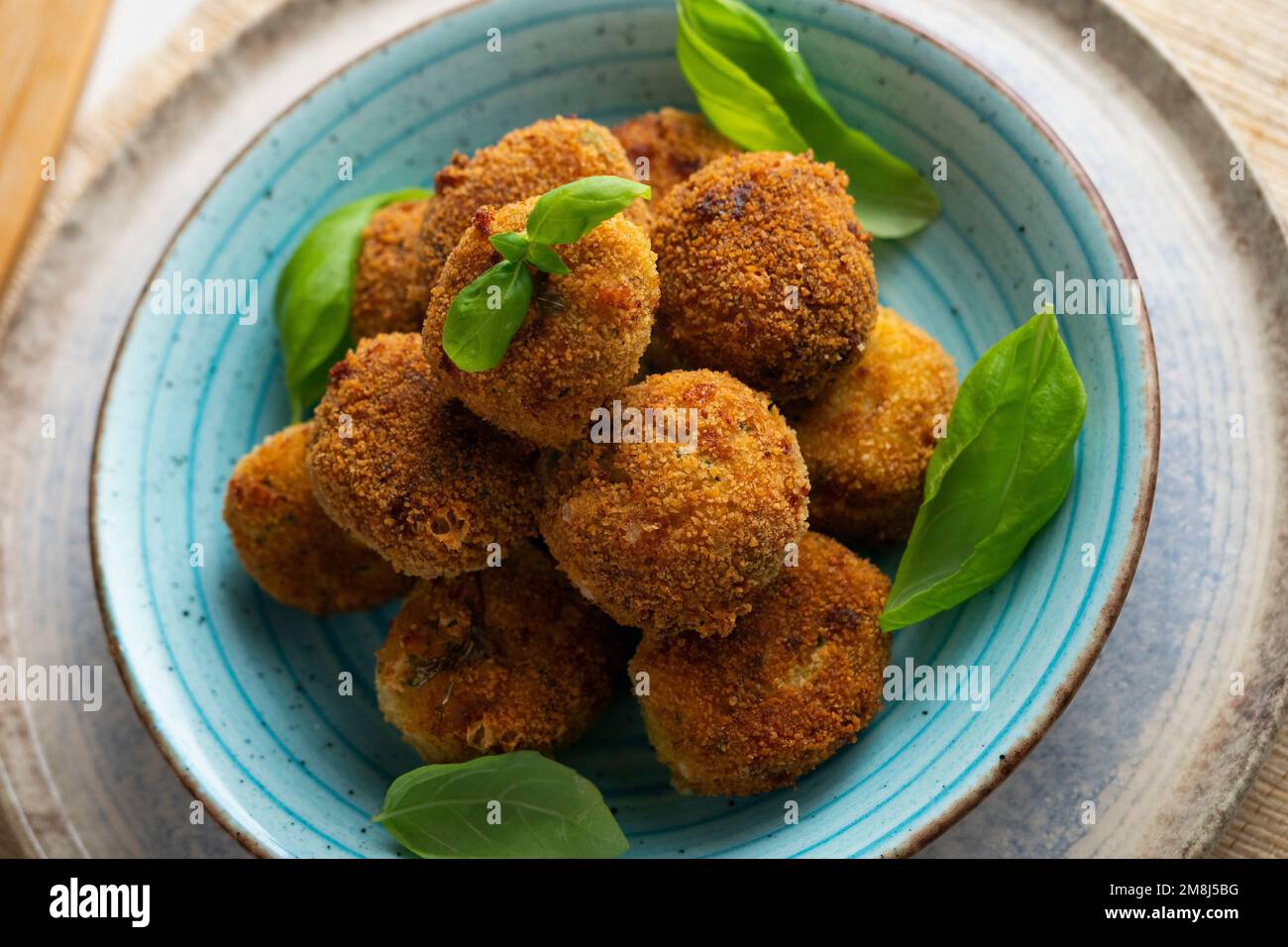 Spanish vegan croquettes. Portion of dough made from a dense sauce such