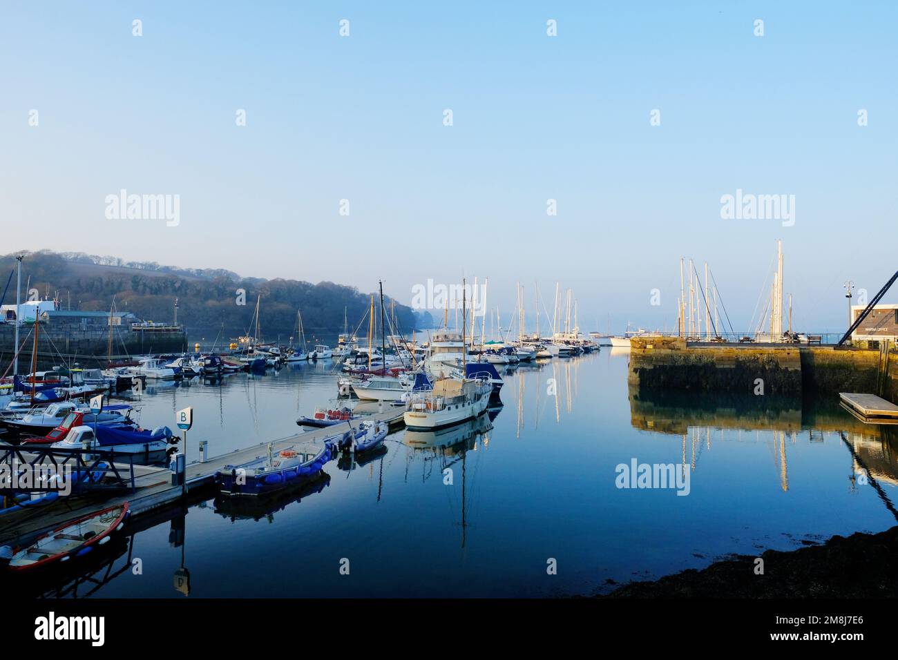Expensive boats moored to floating pontoons at Mylor Yacht Harbour, Cornwall, UK Stock Photo