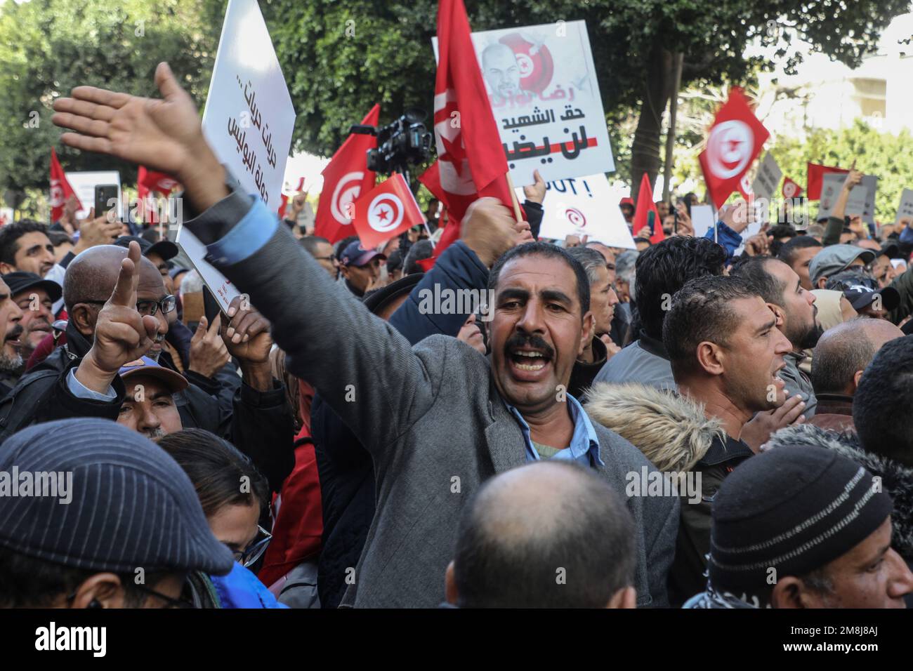 Tunis, Tunisia. 14th Jan, 2023. People shout slogans during a protest