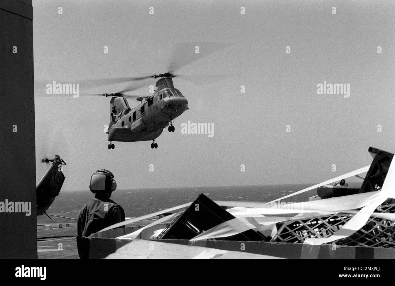 A Marine Corps CH-46 Sea Knight helicopter prepares to land aboard the