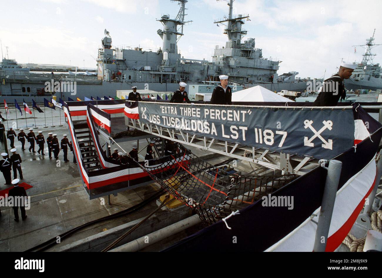 Crewmembers of the tank landing ship USS TUSCALOOSA (LST1187) board