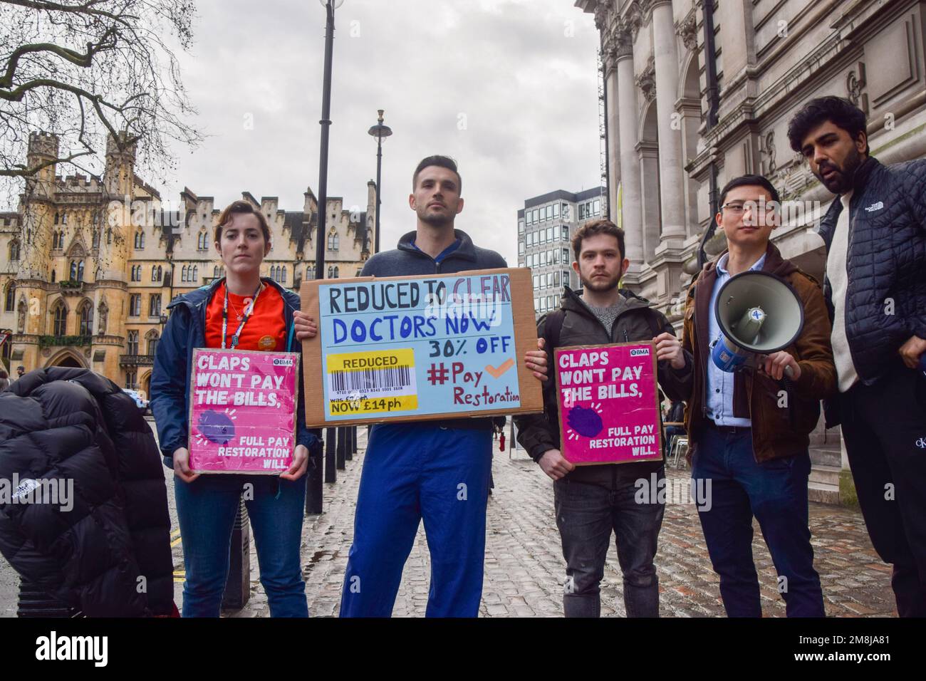 London, UK. 14th January 2023. Junior doctors hold placards ahead of ...