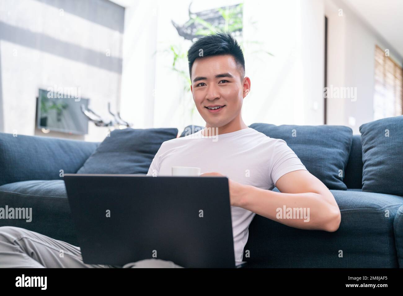Young men who use a computer Stock Photo - Alamy