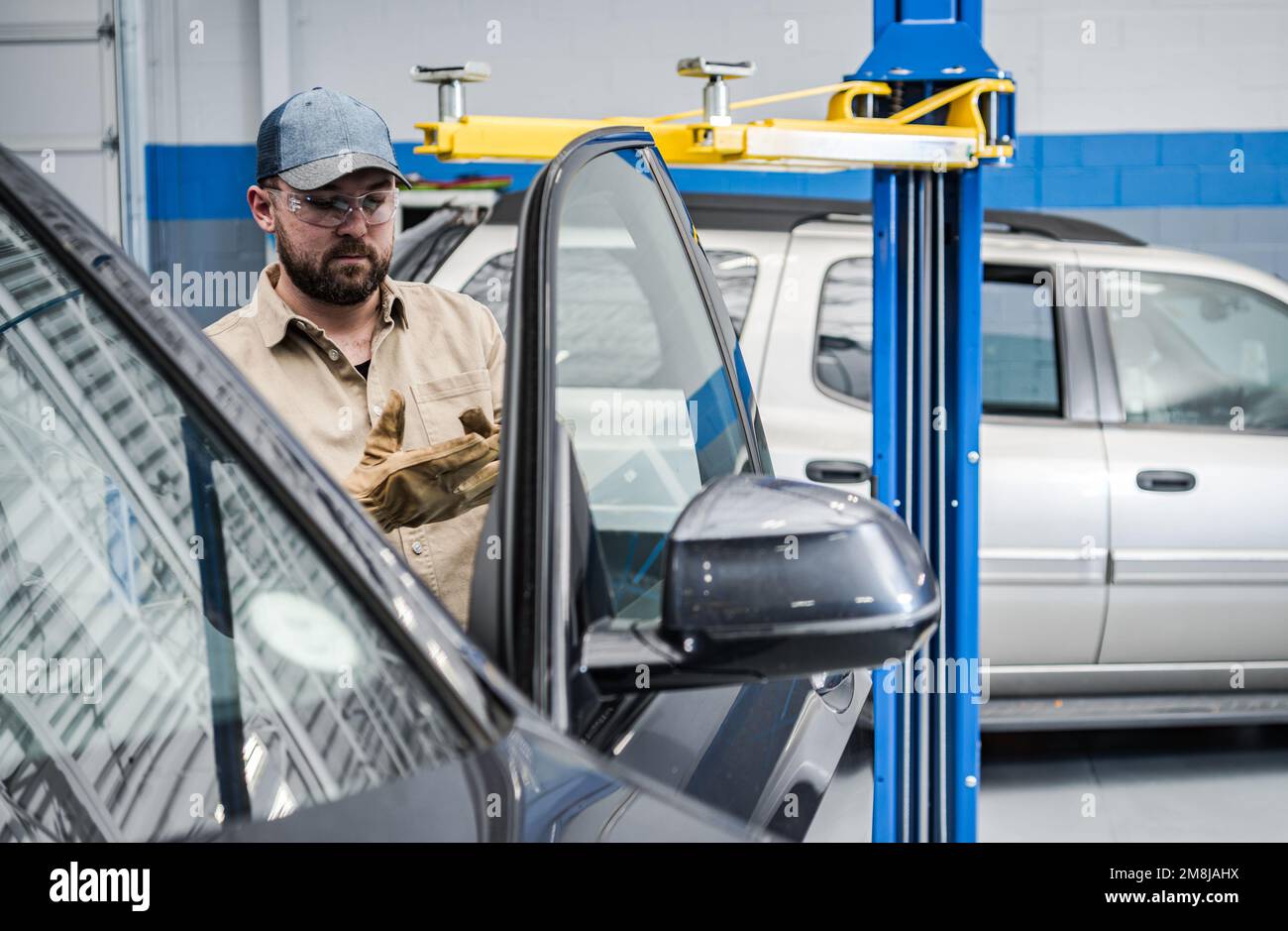 Car Service Mechanic Performing Vehicle Maintenance Inside Authorized