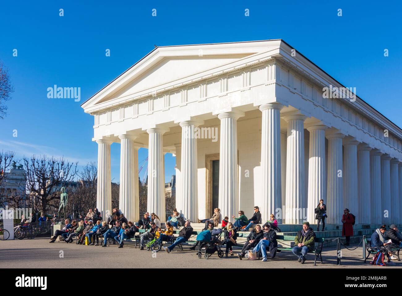 Wien, Vienna: people sunning in front of Theseus Temple in park Volksgarten in 01. Old Town, Wien, Austria Stock Photo