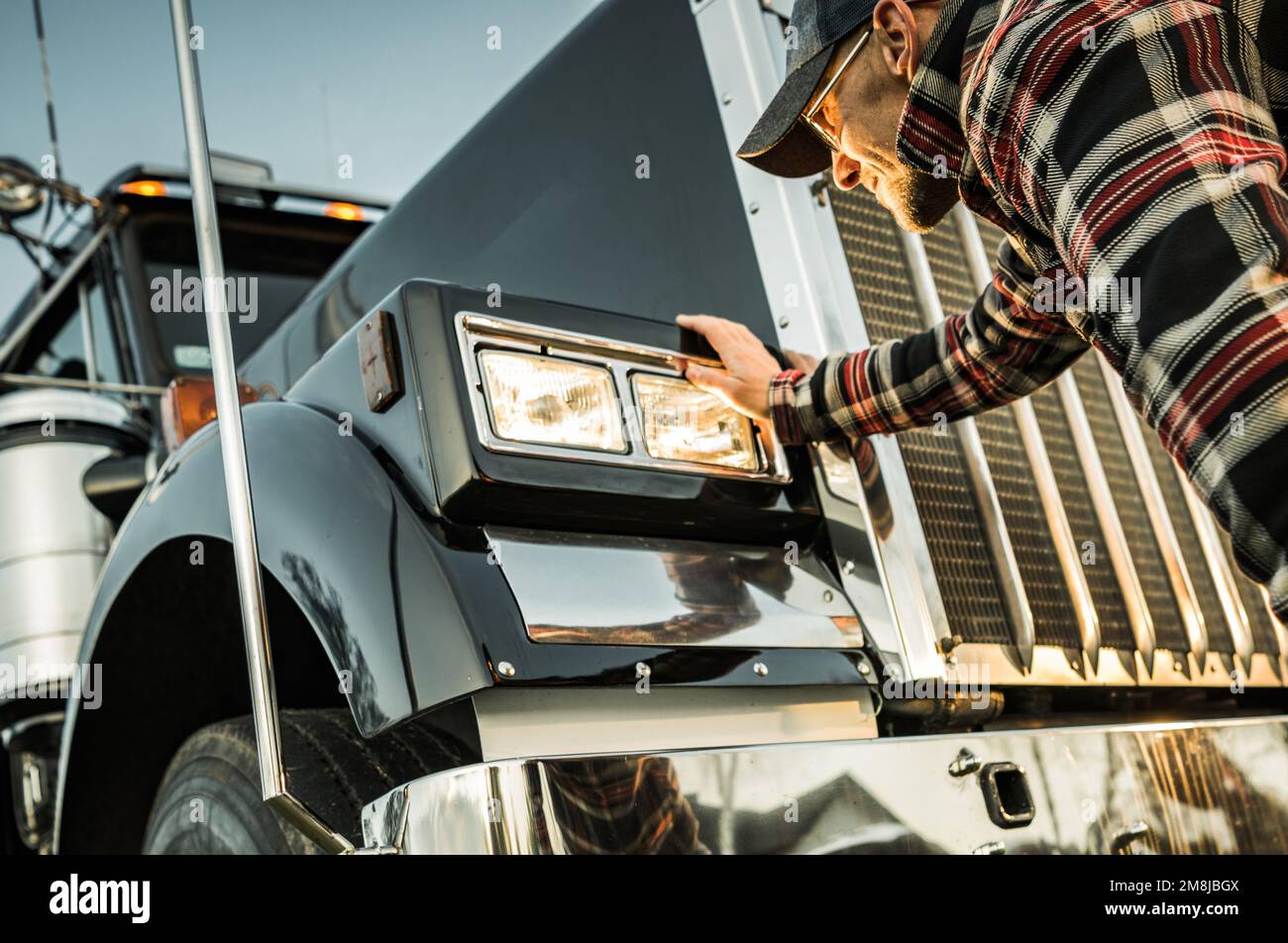 Happy Smiling New Semi Truck Owner. Caucasian Trucker in His 40s Receiving Keys to His New Vehicle. Transportation Industry Theme. Stock Photo