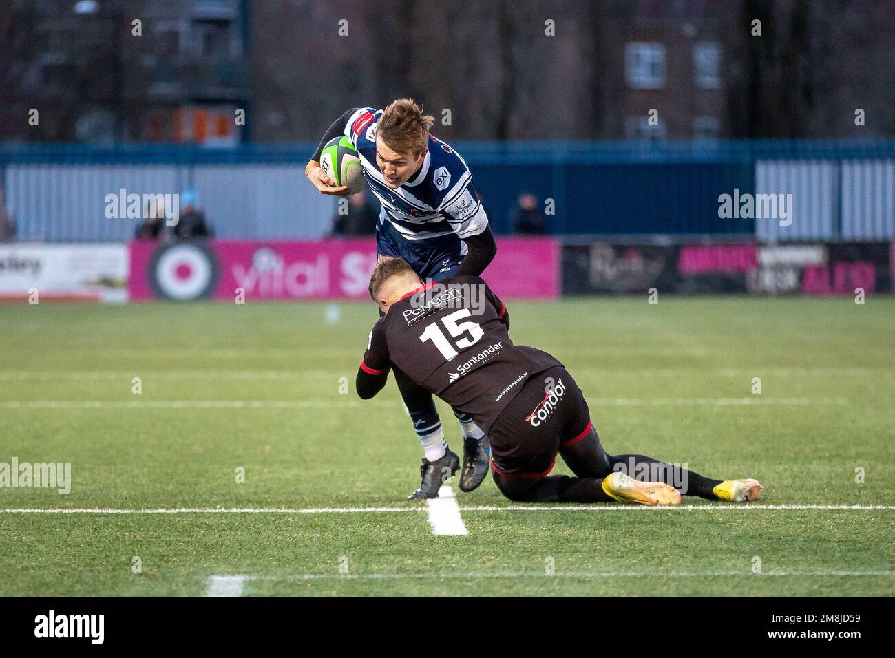 Coventry, UK. 14th Jan, 2023. *** Coventrys James Martin is tackled by Jerseys Brendan Owen during the Rugby Championship match between Coventry and Jersey Reds at Butts Park Arena, Coventry, UK on 14 January 2023. Photo by Simon Hall. Editorial use only, license required for commercial use. No use in betting, games or a single club/league/player publications. Credit: UK Sports Pics Ltd/Alamy Live News Stock Photo
