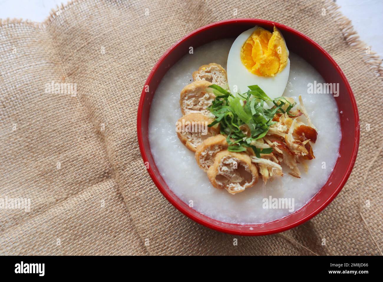 congee porridge with chicken slice, tofu, egg. congee porridge from