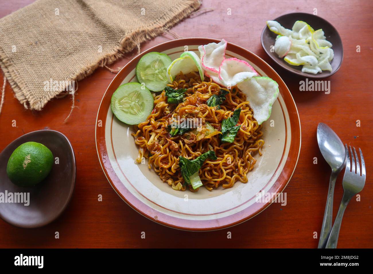 mie tek tek or fried noodle made with egg noodles with chicken, cabbage