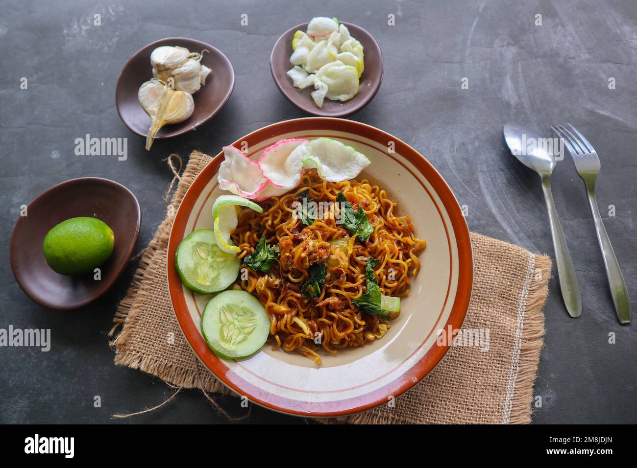 mie tek tek or fried noodle made with egg noodles with chicken, cabbage