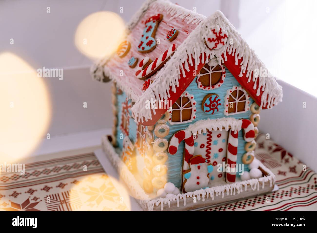 The hand-made eatable gingerbread house and snow decoration Stock Photo