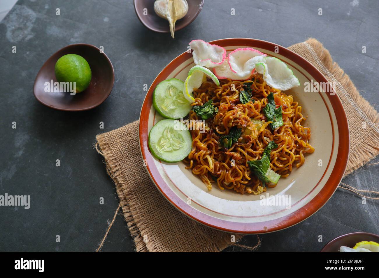 mie tek tek or fried noodle made with egg noodles with chicken, cabbage