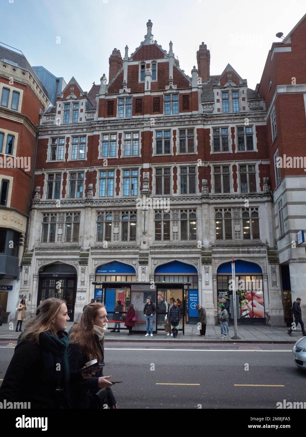 Tesco branch in Bishopgate,  previously Bishopsgate fire station built in 1907, closed as fire station in 1965, London UK Stock Photo