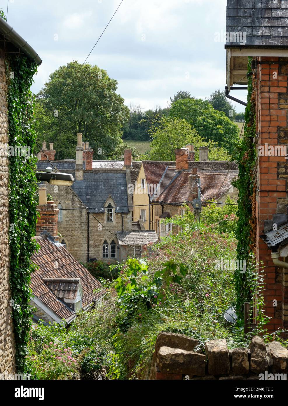 View between the houses to the river in Bruton Stock Photo Alamy