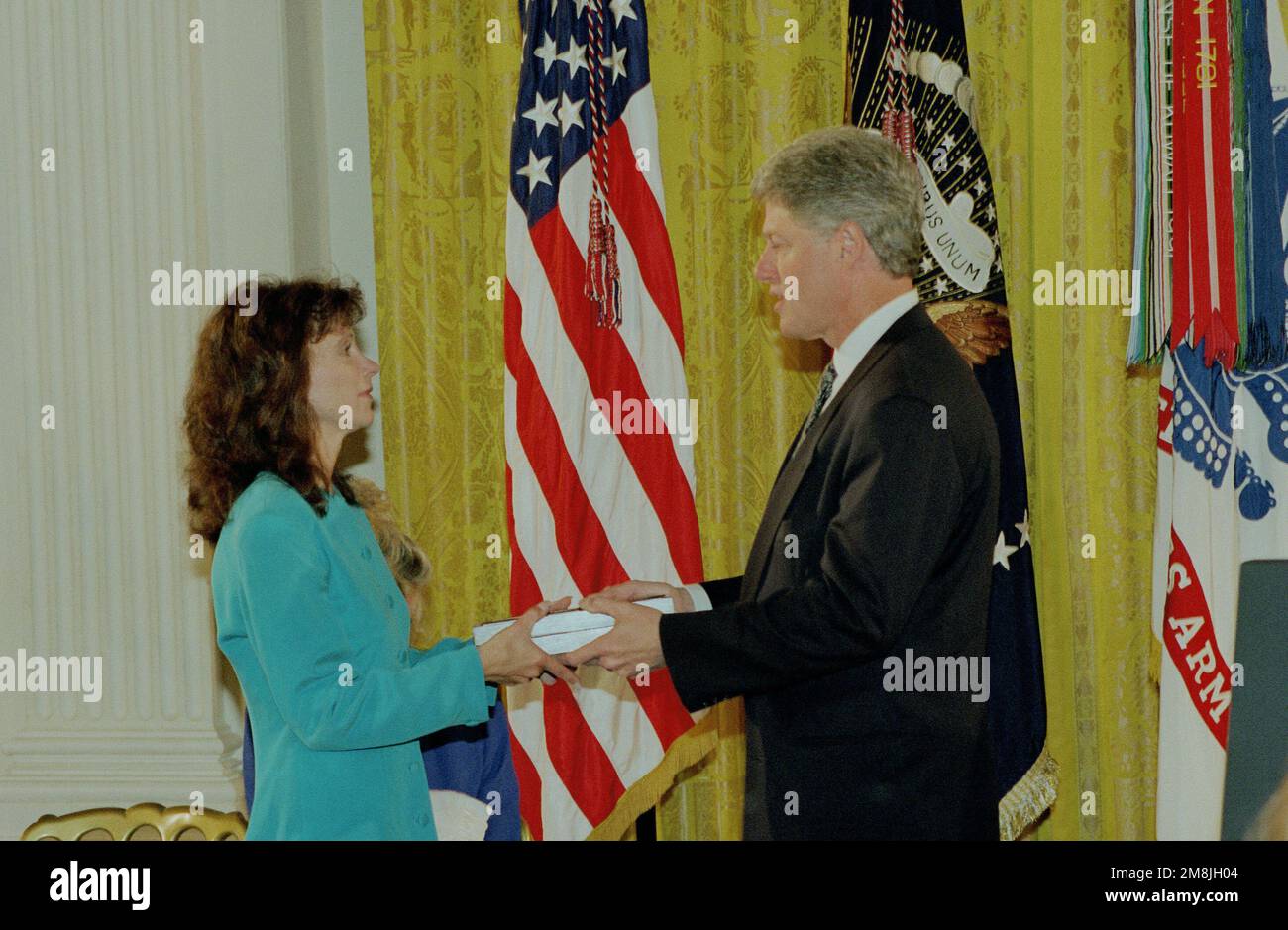 The President of the United States, William J. Clinton presented the nation's highest award for military valor The Medal of Honor (Posthumously) to Stephanie, the widow of Sergeant First Class Randall D. Shughart. SGT Shughart was killed on 03 October 1993, while serving as Sniper Team Member, United States Army Special Operation Command with Task Force Ranger in Mogadishu, Somalia. He and his team leader provided precision sniper fires from the lead helicopter during an assault on a building and at two helicopter crash sites, while subjected to intense automatic weapons and rocket propelled g Stock Photo