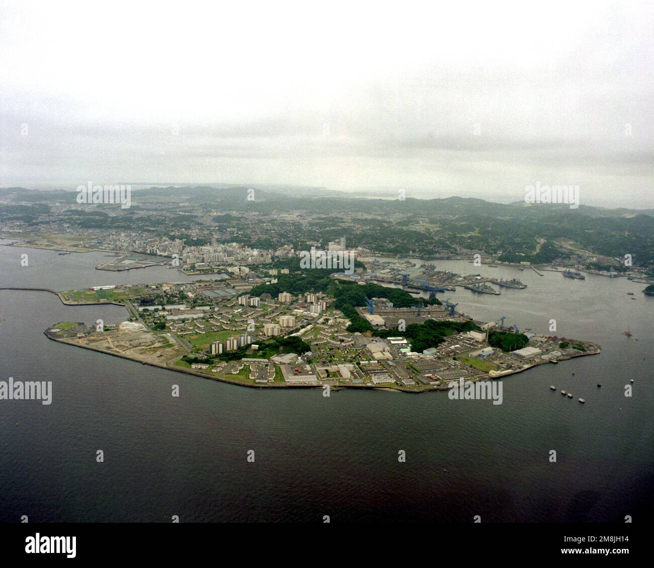 An aerial view of the Yokosuka Naval Base looking southsouthwest. Base