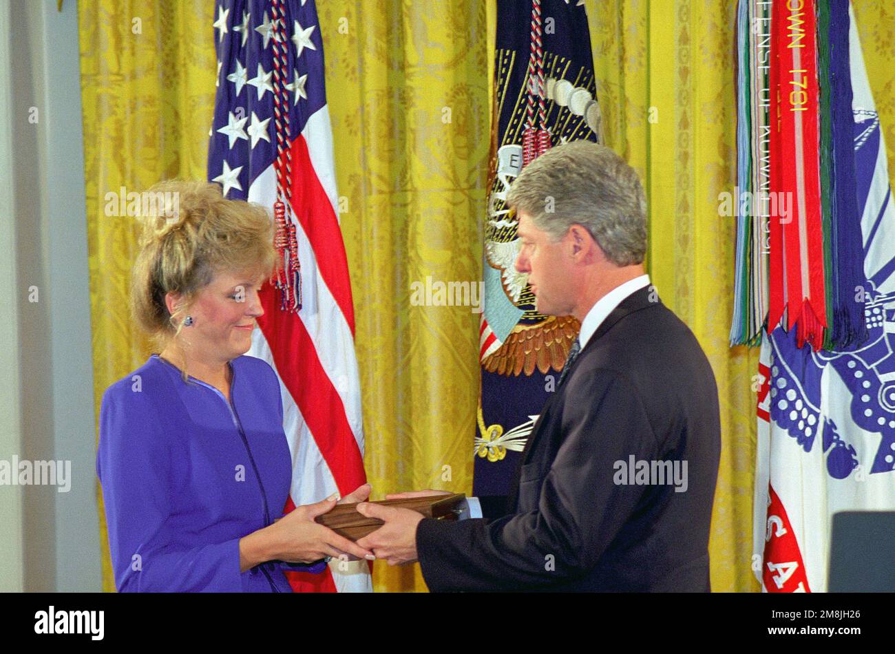 The President of the United States, William J. Clinton presented the nation's highest award for military valor The Medal of Honor (Posthumously) to Carmen, the widow of MASTER Sergeant Gary I. Gordon. He and his Sniper Team Member were killed on 03 October 1993, while serving as Team Leader, United States Army Special Operation Command with Task Force Ranger in Mogadishu, Somalia. They provided precision sniper fires from the lead helicopter during an assault on a building and at two helicopter crash sites, while subjected to intense automatic weapons and rocket propelled grenade fires. Base: Stock Photo