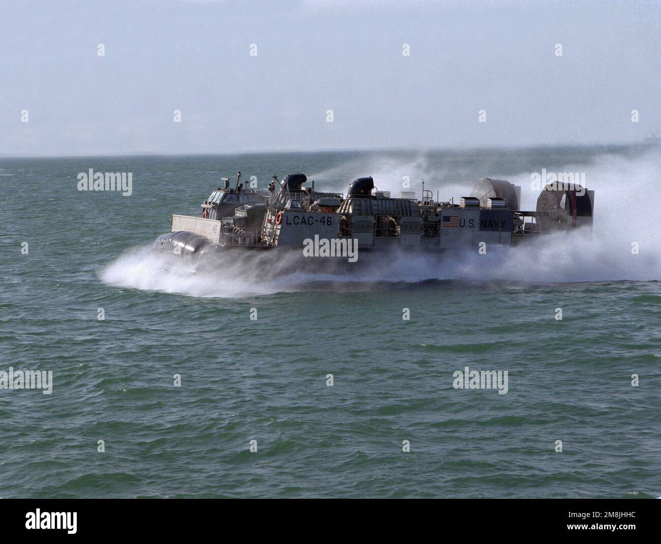 An underway port side view of landing craft air cushion vehicle LCAC-46  during practice beach landings at Naval Station Rota during practice beach  landings at Naval Station Rota during a one week