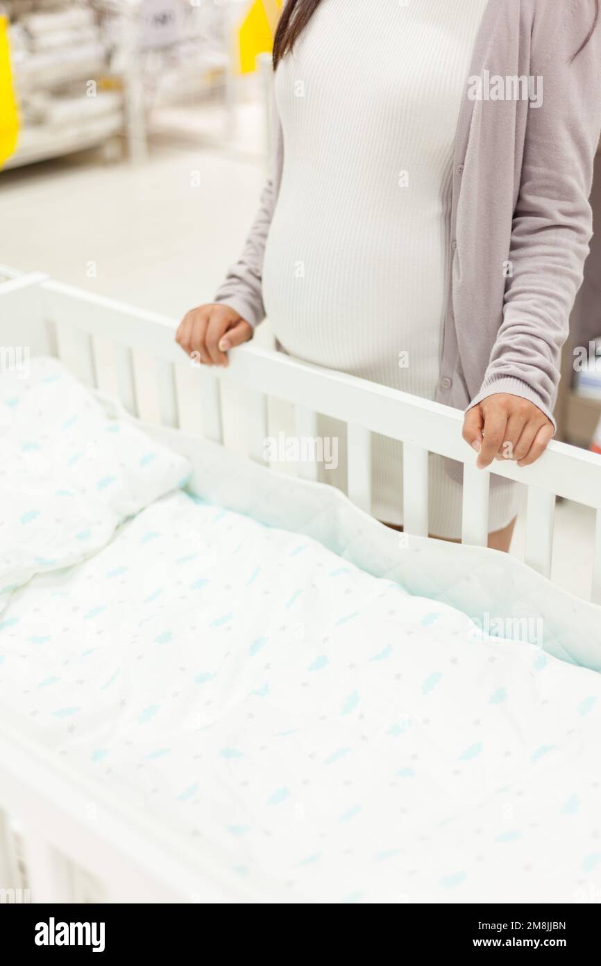 Pregnant women to buy baby products Stock Photo