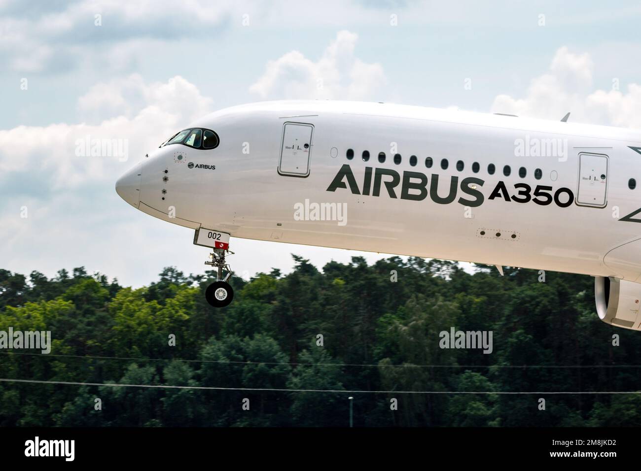 Airbus A350 XWB passenger plane landing on Berlin-Schoneveld airport during the Berlin ILA Airshow. Berlin, Germany - June 2, 2016 Stock Photo