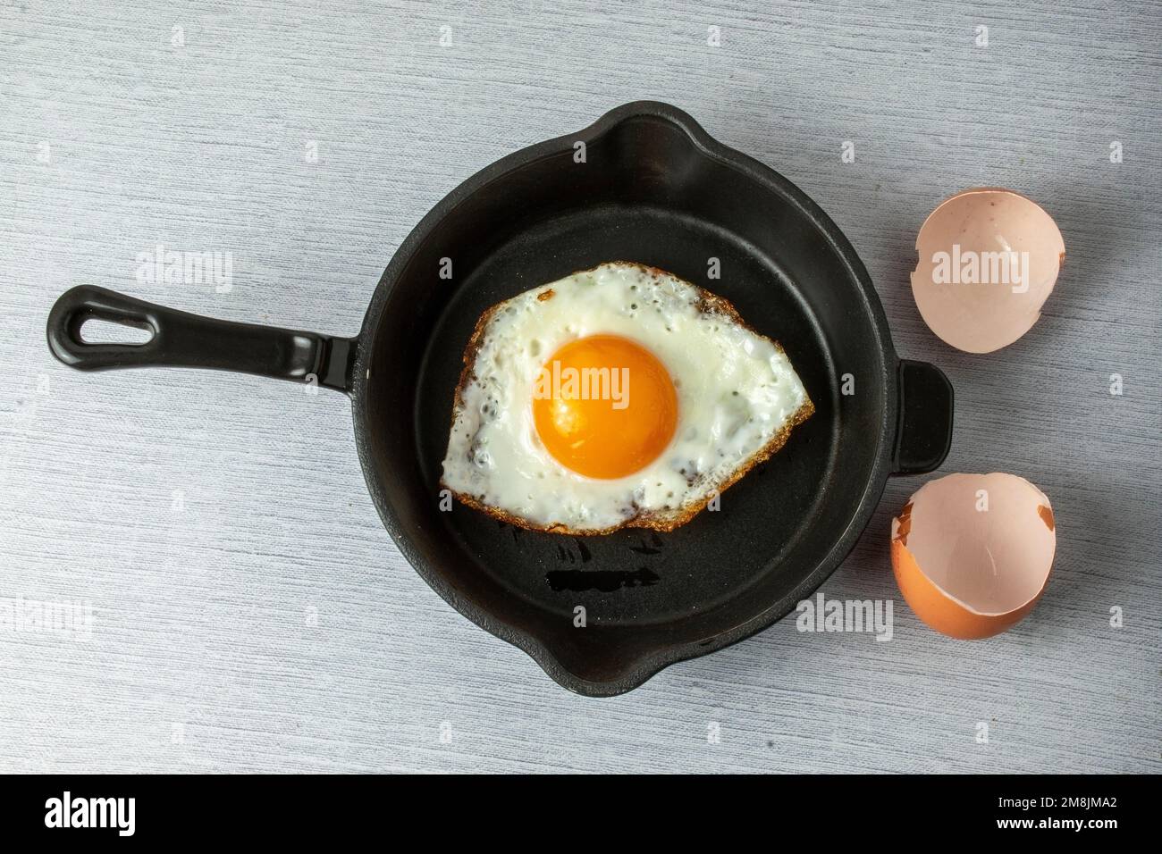 fried egg in a frying pan Stock Photo