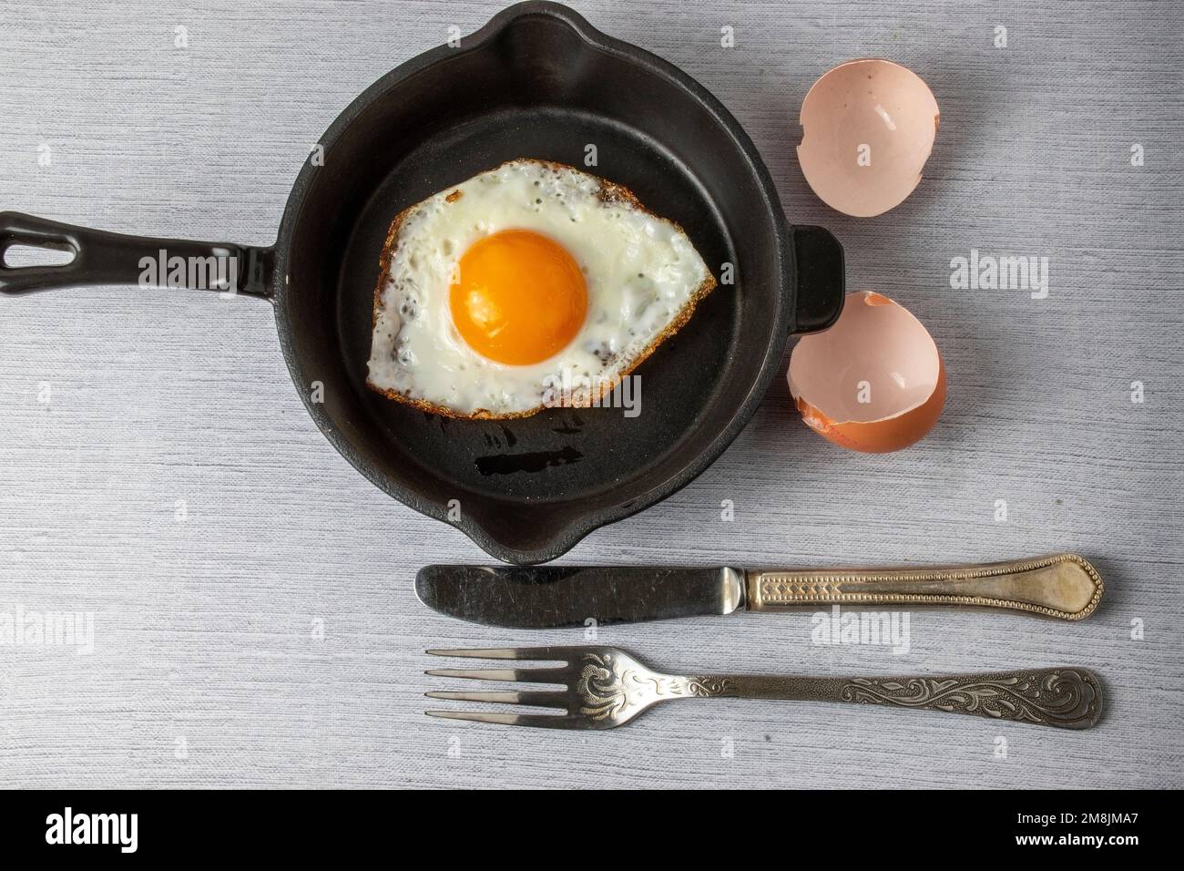 fried egg in a frying pan Stock Photo
