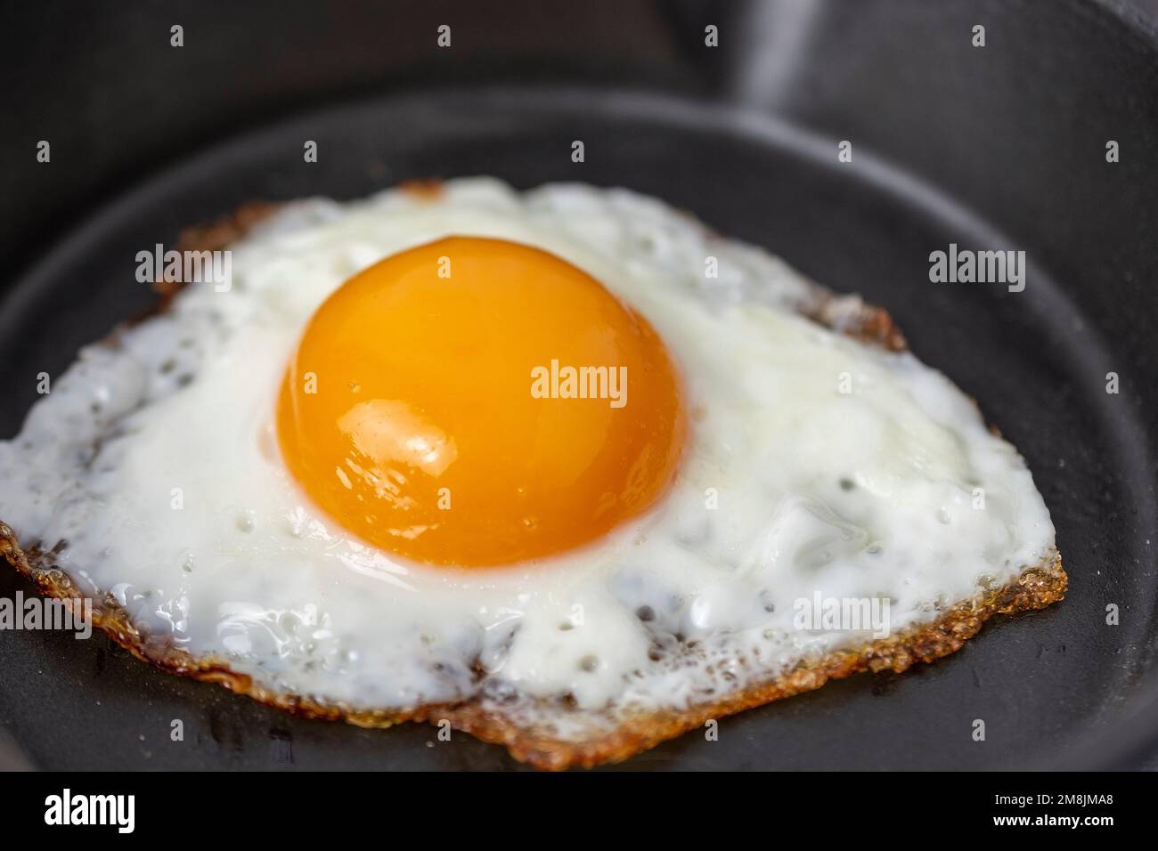 fried egg in a frying pan Stock Photo