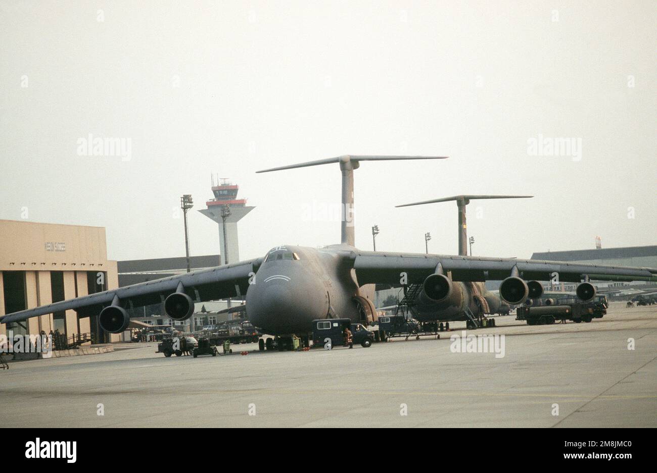 View of the flight line showing Air Mobility Command C-5 Galaxy aircraft used to support the humanitarian airlift of food and supplies to the refugees of the Rwandan civil war. Exact Date Shot Unknown. Subject Operation/Series: SUPPORT HOPE Base: Rhein-Main Air Base Country: Deutschland / Germany (DEU) Stock Photo