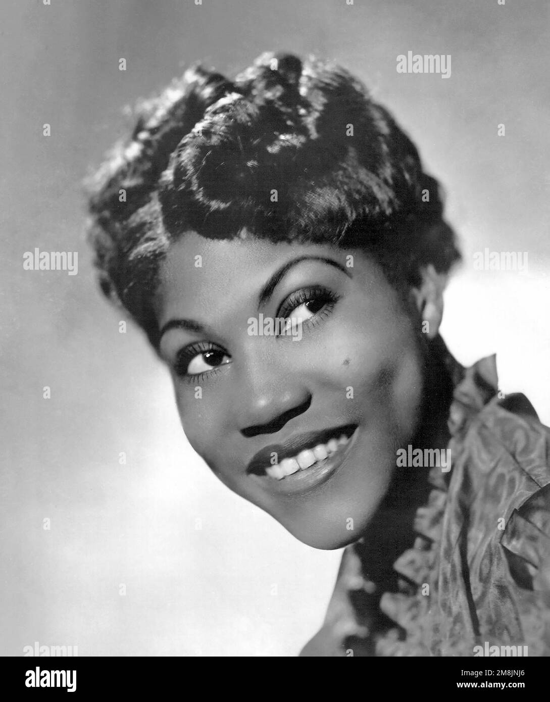 Rosetta Tharpe. Portrait of the American gospel singer, Sister Rosetta Tharpe (b. Rosetta Nubin, 1915-1973), pubicity photo, 1938. Stock Photo