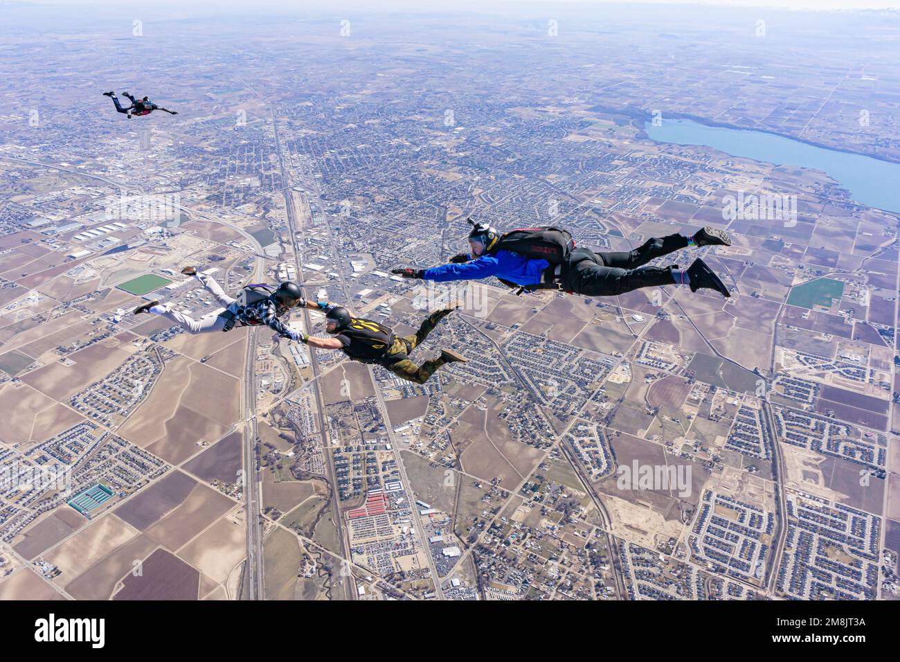 Skydivers jumping out of planes Stock Photo