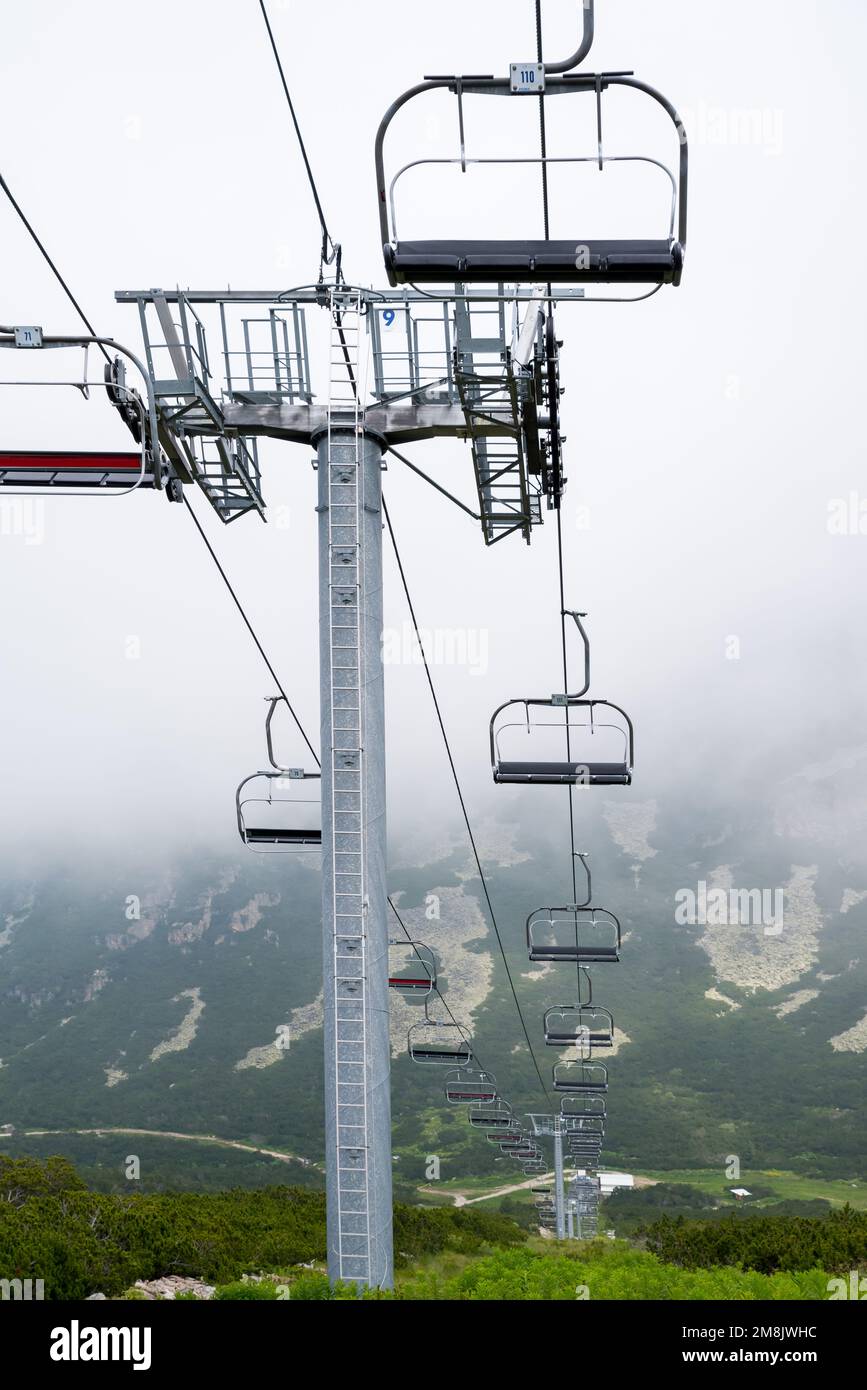 Chair lift. Escalator with wooden seats Stock Photo Alamy