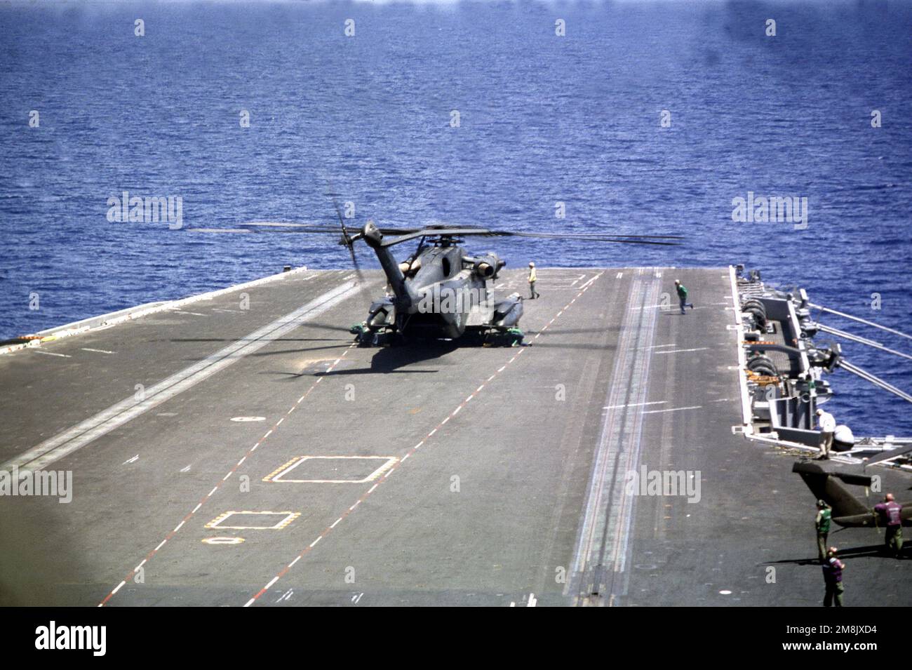 A US Navy H-53 Sea King Helicopter participate in flight operations on board the USS DWIGHT D. EISENHOWER (CVN-69) during the air assault rehearsal Sept. 17, 1994. Subject Operation/Series: RESTORE DEMOCRACY Base: USS Dwight D Eisenhower (CVN 69) Stock Photo