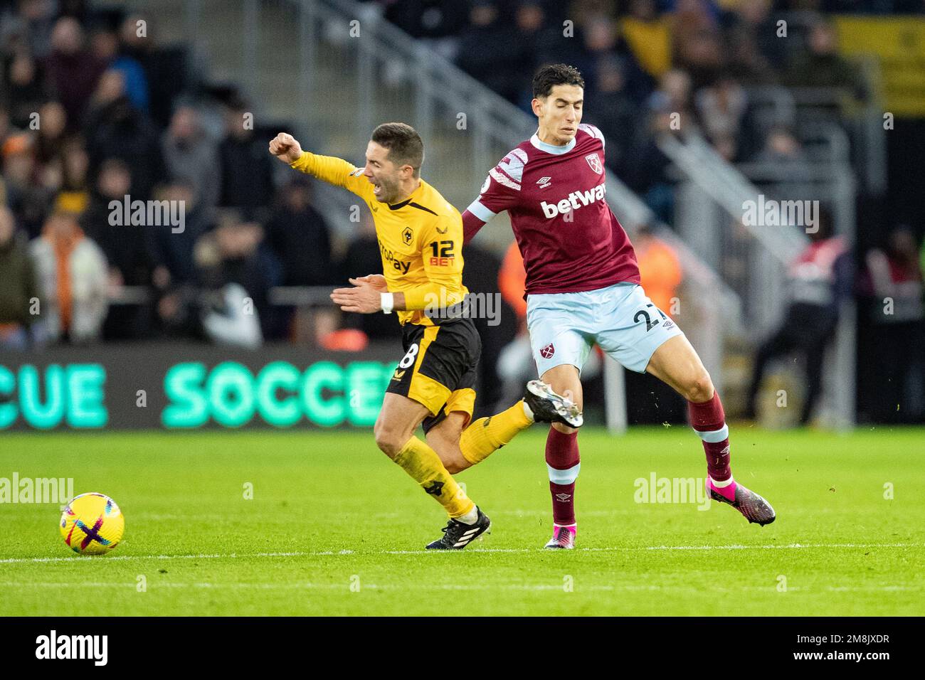 Joao Moutinho of Wolves is fouled by Nayef Aguerd of West Ham during the Premier League match between Wolverhampton Wanderers and West Ham United at Molineux, Wolverhampton on Saturday 14th January 2023