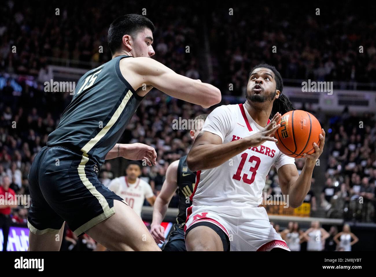 Nebraska forward Derrick Walker (13) shoots over Purdue center Zach