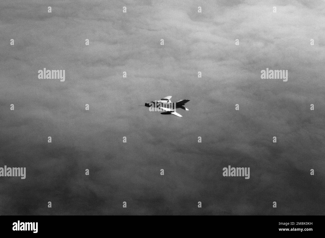Aerial view of a Peoples Republic of China Liberation Army Air Force FT-6 Farmer-F fighter trainer aircraft in flight. Country: South China Sea Stock Photo