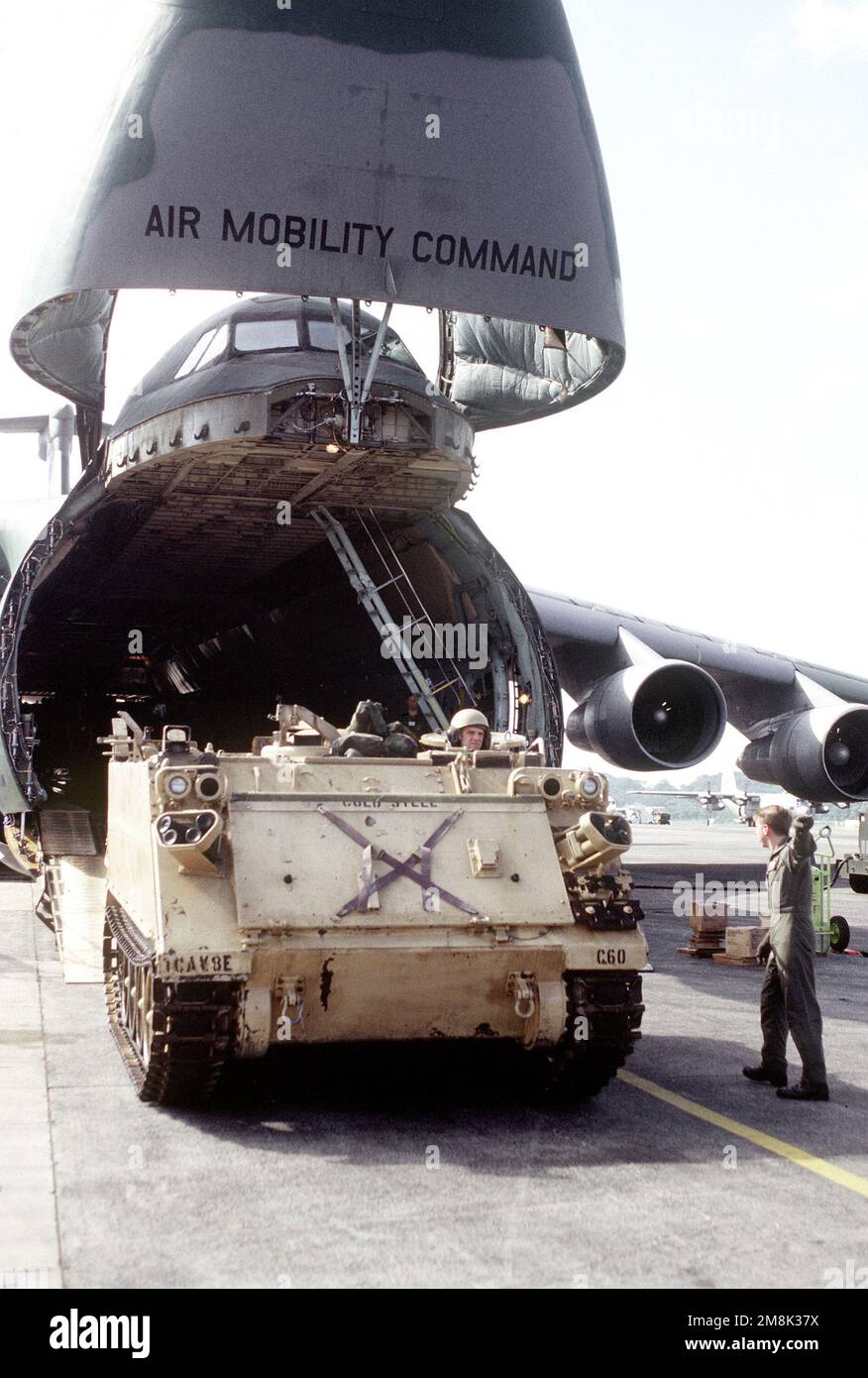 A U.S. Army M113A2 Armored Personnel Carrier is driven off a U.S. Air Force C-5 Galaxy at Howard AFB. The Air Force is flying in materials and personnel for increased activities during Operation Safe Haven. Subject Operation/Series: SAFE HAVEN Base: Howard Air Force Base Country: Panama (PAN) Stock Photo