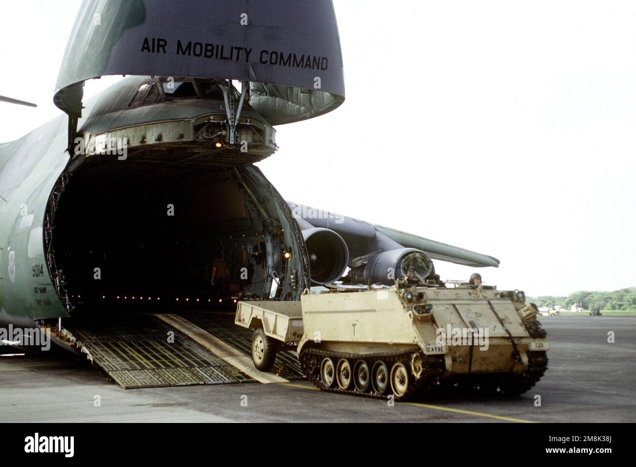 A U.S. Army M113A2 Armored Personnel Carrier is driven off a U.S. Air Force C-5 Galaxy at Howard AFB. The Air Force is flying in materials and personnel for increased activities during Operation Safe Haven. Subject Operation/Series: SAFE HAVEN Base: Howard Air Force Base Country: Panama (PAN) Stock Photo