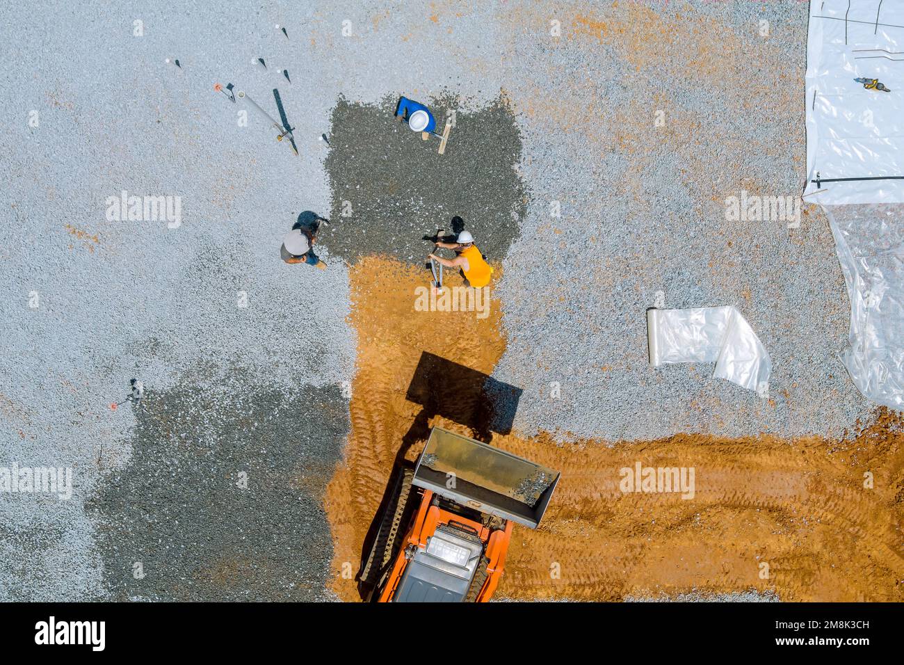 An excavator bucket used before concrete foundation is poured on site
