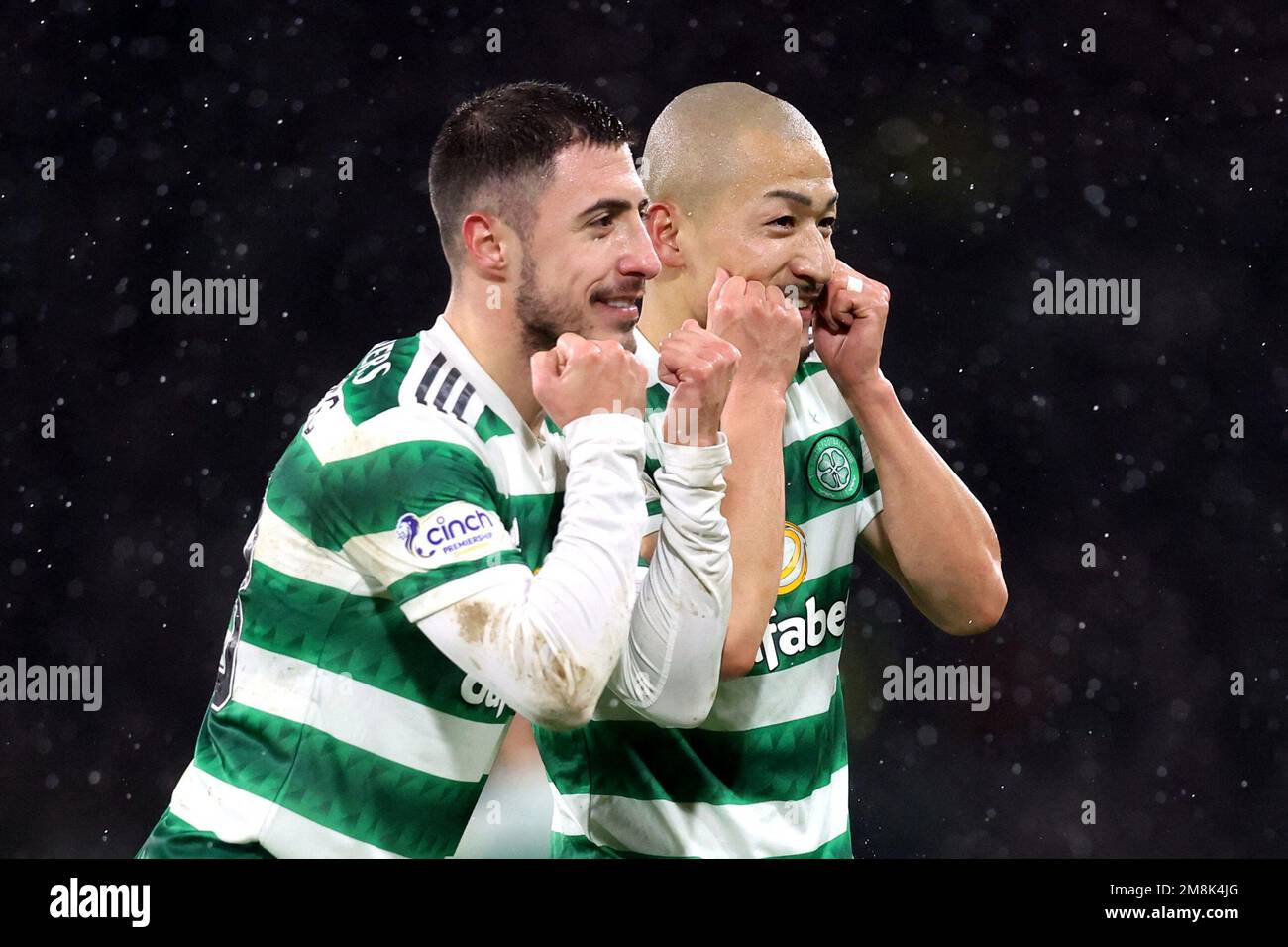 Soccer Football - Scottish League Cup - Semi Final - Celtic v Kilmarnock - Hampden Park, Glasgow, Scotland, Britain - January 14, 2023 Celtic's Daizen Maeda celebrates scoring their second goal  with Josip Juranovic before it is disallowed after a VAR review REUTERS/Russell Cheyne Stock Photo