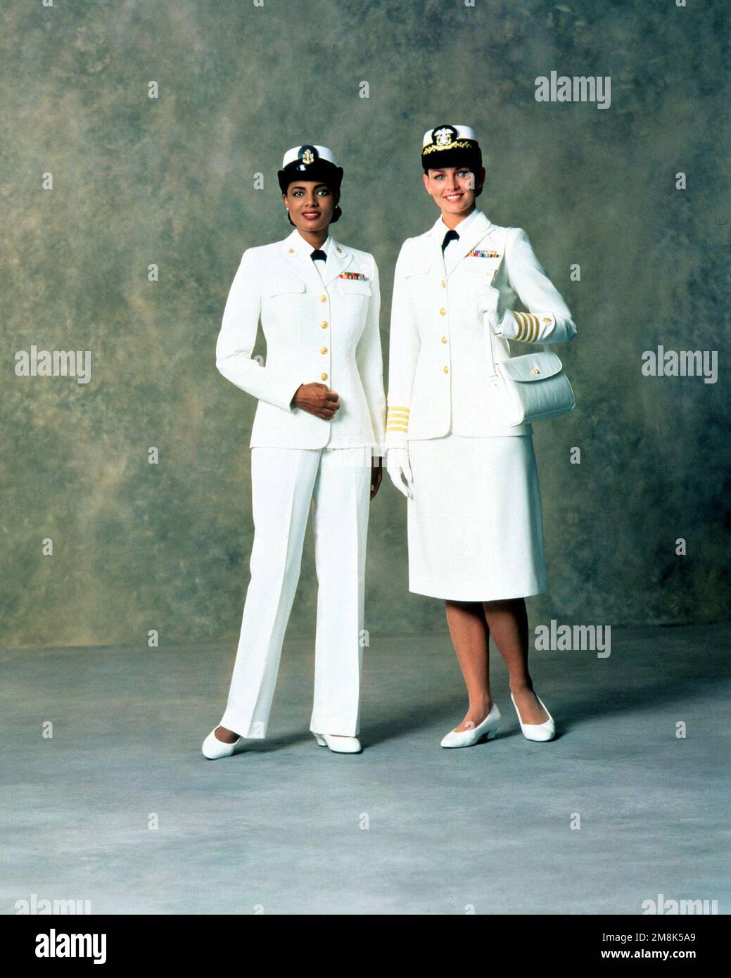 Left, Service Dress White uniform with slacks for women CHIEF PETTY  Officers. Right, Service Dress White uniform for women officers. Country:  Unknown Stock Photo - Alamy