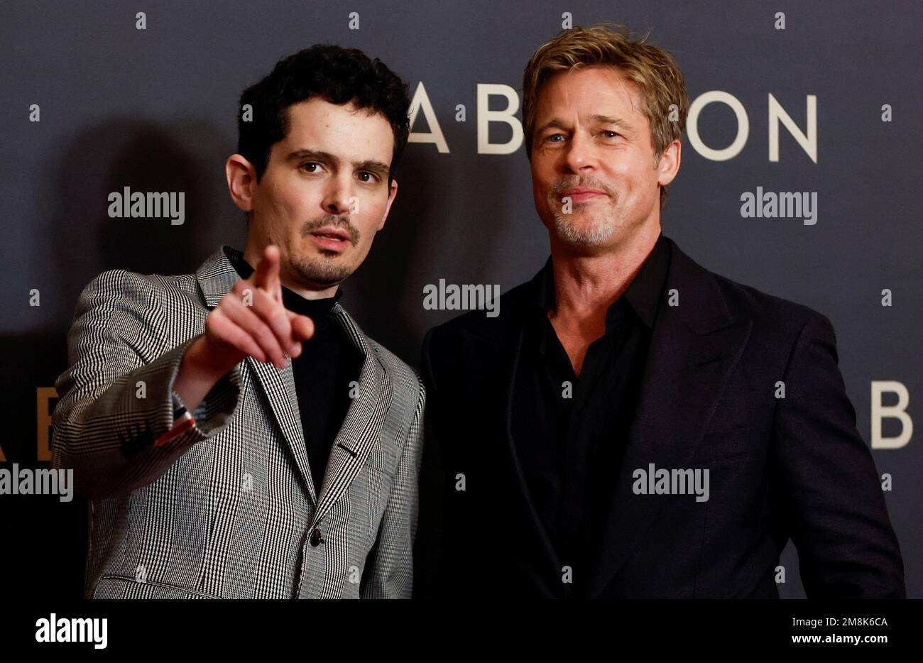 Director Damien Chazelle and actor Brad Pitt pose during a photocall ...